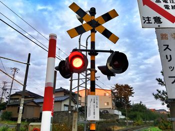 Low angle view of building against cloudy sky