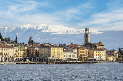 The lakeside of salò with the monte baldo in background