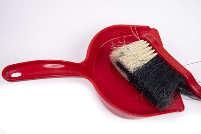 High angle view of red paint against white background