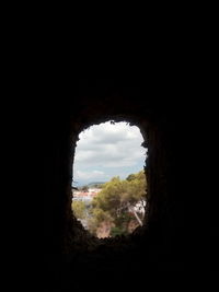 Scenic view of cave seen through arch