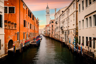 Canal amidst buildings in city