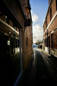 Street amidst buildings in city against sky