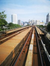 High angle view of railroad tracks in city against sky