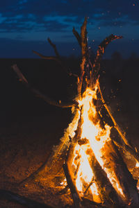 Close-up of bonfire against sky at night