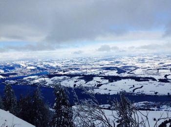 Aerial view of landscape against sky during winter