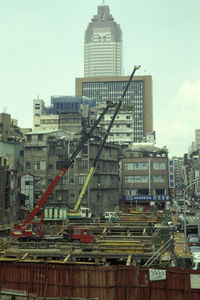 Modern buildings in city against sky