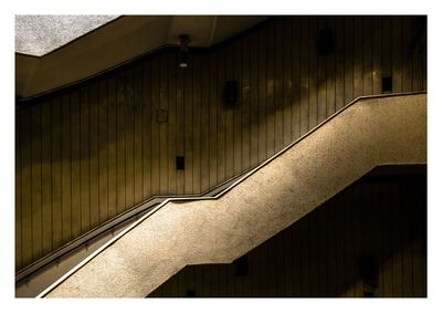 Low angle view of steps against wall