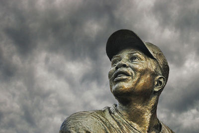 Low angle view of statue against cloudy sky