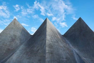 Low angle view of historical building against cloudy sky. 