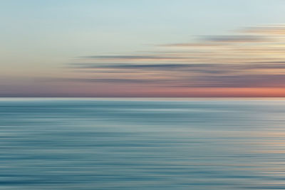 Scenic view of sea against sky at sunset