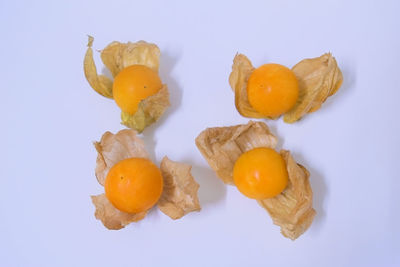 Close-up of fruits against white background