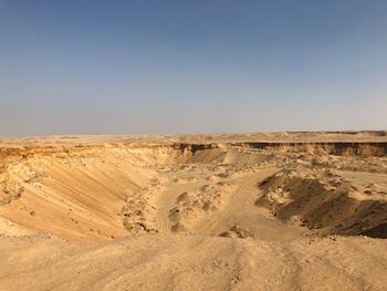 Scenic view of desert against clear sky