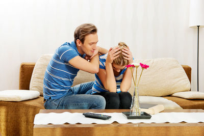 Couple discussing documents at home