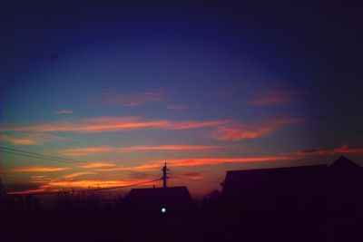 Silhouette of built structure at sunset