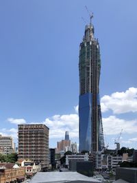 Low angle view of buildings against blue sky