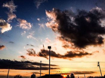 Low angle view of cloudy sky at sunset