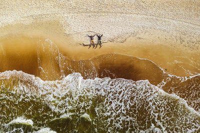 High angle view of man surfing in sea