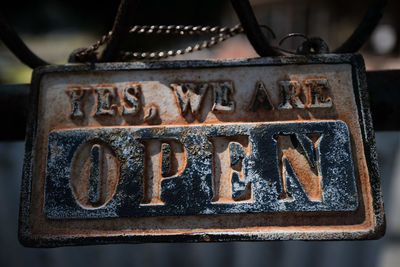 Close-up of text on rusty metal