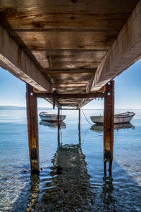 Pier over sea against sky