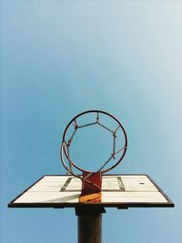 Low angle view of basketball hoop against clear sky