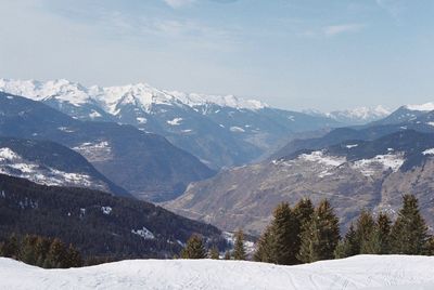 Scenic view of snowcapped mountains against sky