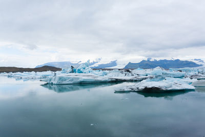 Scenic view of frozen lake against sky