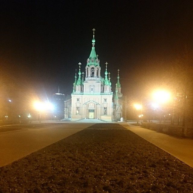 building exterior, architecture, built structure, religion, church, illuminated, night, place of worship, spirituality, the way forward, street, cathedral, road, city, street light, outdoors, sky, clear sky