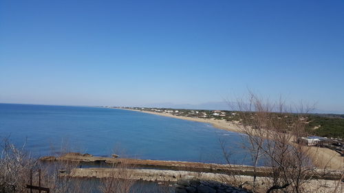 Scenic view of sea against clear blue sky