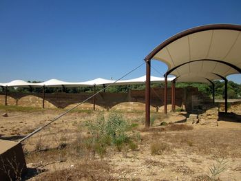 Built structure on field against clear sky