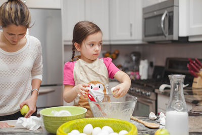 Cute girl having food at home