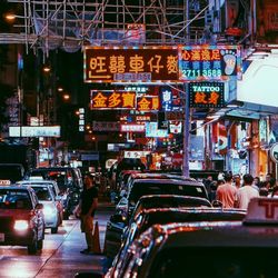 Illuminated city street at night