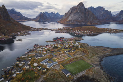 High angle view of lake by buildings against sky