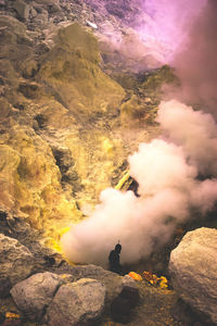 Man standing on volcano