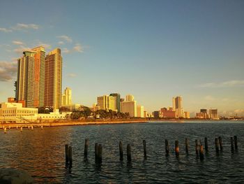 Buildings in city against sky