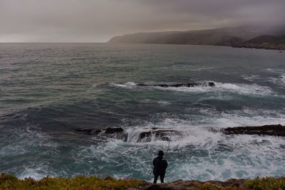 People standing on rocks