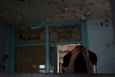 Man in abandoned room