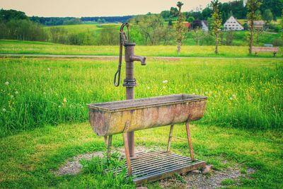 Abandoned barn on field against sky