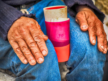 Midsection of woman holding hands