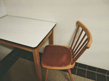 Close-up of chairs on table