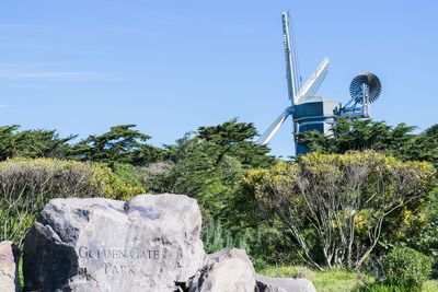 Low angle view of traditional windmill against sky