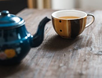 Close-up of coffee cup on table