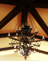 Low angle view of illuminated chandelier