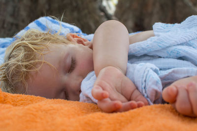 Close-up of baby sleeping outdoors