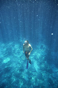 Full length of man snorkeling in sea