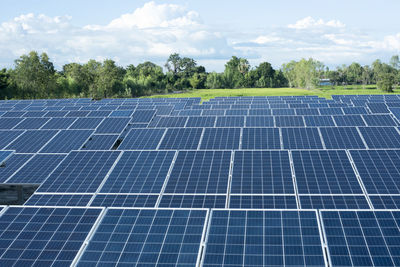 Low angle view of solar panels against sky