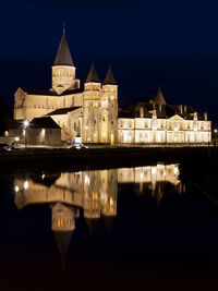 Reflection of illuminated buildings in water at night