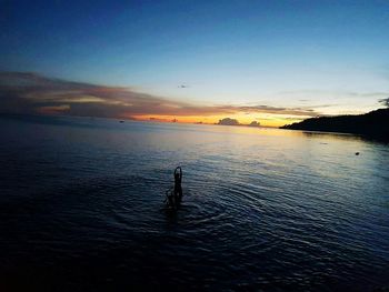 Scenic view of sea against sky at sunset