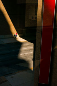 High angle view of people standing on footpath in building