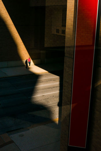 High angle view of people standing on footpath in building