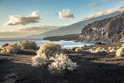 Scenic view of sea against cloudy sky